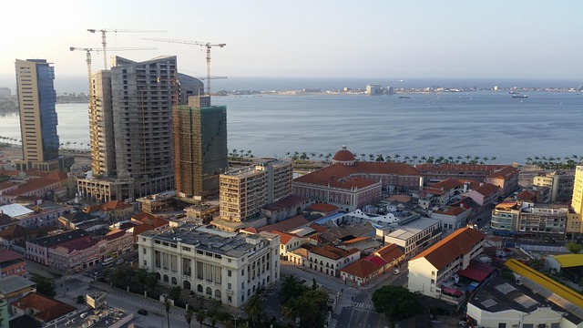 Best Time To Visit Luanda – Clear skies over Luanda Bay with city skyline and calm blue waters during the dry season